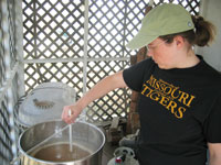Jessica stirs as the wort comes to a boil.